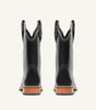 Custom brown cowboy boot with embossed black floral leather upper - side view